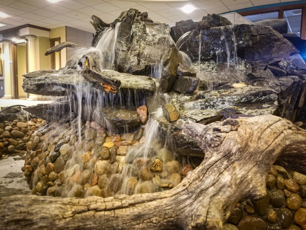 photo of a large indoor rock water feature