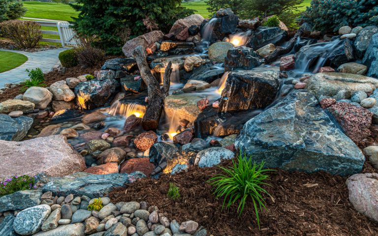 photo of a large natural rock water feature