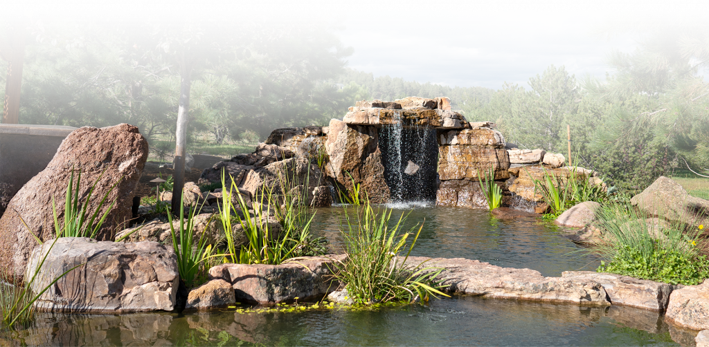 a large pond with cascading waterfalls